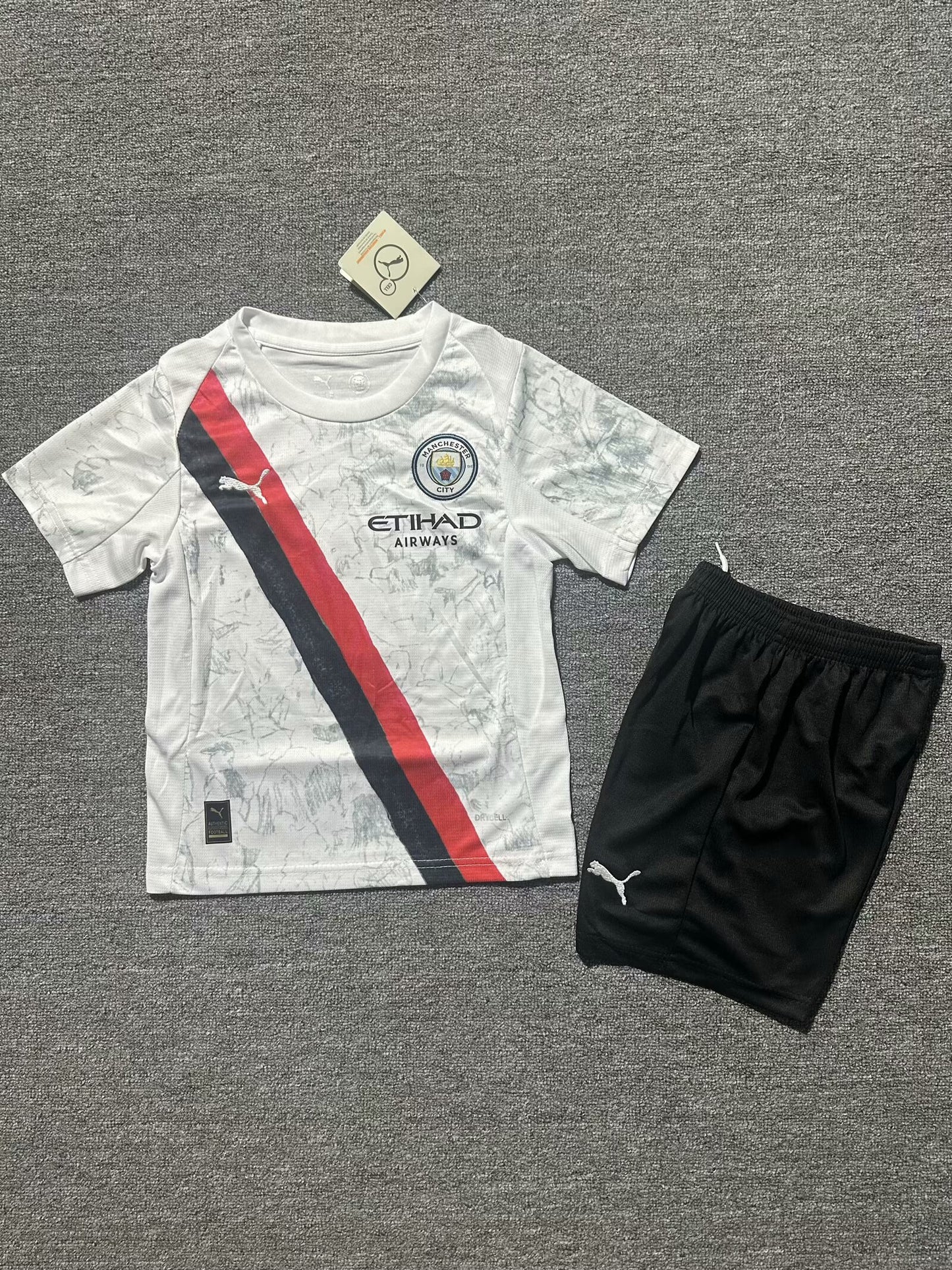 Manchester City 2025-26 Away Kids Kit